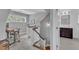Hallway with a staircase and office space that leads to an ensuite bathroom at 425 Morrison Ave, Raleigh, NC 27608