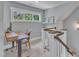Hallway with a staircase and office space featuring natural light at 425 Morrison Ave, Raleigh, NC 27608