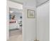 Hallway view leading to bedroom with a decorated bed and art at 425 Morrison Ave, Raleigh, NC 27608