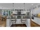 Bright kitchen with a large center island, stainless steel appliances and mosaic backsplash at 425 Morrison Ave, Raleigh, NC 27608