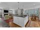 Open kitchen featuring central island with sink, and views of living and dining rooms at 425 Morrison Ave, Raleigh, NC 27608