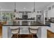 Spacious kitchen with a large center island, stainless steel appliances and mosaic backsplash at 425 Morrison Ave, Raleigh, NC 27608