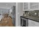 Modern kitchen featuring stainless steel refrigerator, wine cooler and cabinetry at 425 Morrison Ave, Raleigh, NC 27608