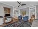 Comfortable living area featuring hardwood floors, a ceiling fan, and an adjacent staircase at 425 Morrison Ave, Raleigh, NC 27608