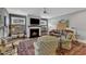 Comfortable living room with a fireplace, plush seating, and natural light at 425 Morrison Ave, Raleigh, NC 27608