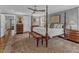 Serene main bedroom featuring a four-poster bed, hardwood floors, and elegant furnishings at 425 Morrison Ave, Raleigh, NC 27608