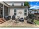 Stone patio featuring outdoor seating and a fire pit, screened-in porch, and grill at 425 Morrison Ave, Raleigh, NC 27608