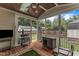 Screened porch with wooden floors and ceiling that overlooks the backyard at 425 Morrison Ave, Raleigh, NC 27608