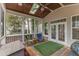 Comfortable screened porch with a wooden ceiling and a ceiling fan at 425 Morrison Ave, Raleigh, NC 27608