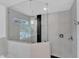 Contemporary shower with glass enclosure, neutral tile, and modern fixtures at 425 Morrison Ave, Raleigh, NC 27608