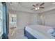 Comfortable bedroom boasting a tray ceiling, plush carpet, and access to a bathroom at 445 Brier Summit Pl, Durham, NC 27703