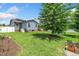 Lush backyard with mature trees, well-manicured lawn, and beautiful greenery, perfect for outdoor enjoyment at 45 Imperial Dr, Clayton, NC 27527