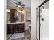 Well-lit bathroom featuring a dark wood vanity with marble countertop and framed shower at 45 Imperial Dr, Clayton, NC 27527