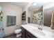 Bathroom featuring dark wood vanity with white counter, toilet, and shower with playful animal curtain at 45 Imperial Dr, Clayton, NC 27527