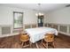 Traditional dining room features chair rail, a large window, and wood-look flooring at 45 Imperial Dr, Clayton, NC 27527