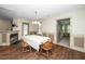 Formal dining room with decorative fireplace, wood-look floors, and natural light at 45 Imperial Dr, Clayton, NC 27527