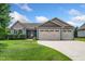Charming single-story home with a well-manicured lawn and three-car garage at 45 Imperial Dr, Clayton, NC 27527