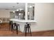 Open concept kitchen with stainless steel appliances, breakfast bar and modern pendant lighting at 45 Imperial Dr, Clayton, NC 27527