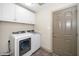 Convenient laundry room with modern washer and dryer and ample storage space at 45 Imperial Dr, Clayton, NC 27527