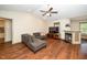 Comfortable living room features a fireplace, hardwood flooring, and open concept design at 45 Imperial Dr, Clayton, NC 27527