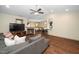 Cozy living room featuring a fireplace, hardwood floors, and seamless access to the dining and kitchen spaces at 45 Imperial Dr, Clayton, NC 27527