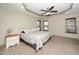 Spacious primary bedroom with ceiling fan, recessed lighting, and bright windows at 45 Imperial Dr, Clayton, NC 27527