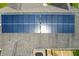 Aerial view of a home's roof showcasing solar panels, accompanied by a wooden deck and partially visible hot tub at 45 Imperial Dr, Clayton, NC 27527