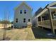 Backyard featuring a grassy area with a view of the home's exterior at 500 Yeowell Dr, Chapel Hill, NC 27514