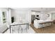 Modern kitchen with white cabinets, stainless steel appliances, and a large island with breakfast bar at 500 Yeowell Dr, Chapel Hill, NC 27514