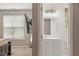 Bathroom featuring a vanity with mirror, a TV in the bedroom, and a window at 5003 Celtic Ct, Raleigh, NC 27612