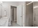 Bathroom featuring double sinks, white cabinets and drawers, and walk in shower at 5003 Celtic Ct, Raleigh, NC 27612