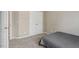 Neutral bedroom with carpet, white closet doors, and natural light at 5003 Celtic Ct, Raleigh, NC 27612