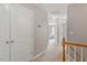 Upstairs hallway featuring neutral walls and carpet at 5003 Celtic Ct, Raleigh, NC 27612