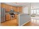 Well-appointed kitchen with stainless steel appliances and wooden cabinetry at 5003 Celtic Ct, Raleigh, NC 27612