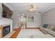 Spacious living room with a fireplace, hardwood floors, and an open layout at 5003 Celtic Ct, Raleigh, NC 27612