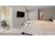 Cozy bedroom with plush carpeting, a TV, and an attached balcony at 5003 Celtic Ct, Raleigh, NC 27612