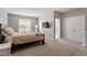 Spacious bedroom features plush carpeting, a TV, a full size mirror, and ample closet space at 5003 Celtic Ct, Raleigh, NC 27612