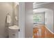Stylish powder room located near the dining area with modern fixtures and finishes at 5003 Celtic Ct, Raleigh, NC 27612