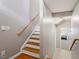 Bright staircase with hardwood treads and neutral walls leading to the upper level at 5003 Celtic Ct, Raleigh, NC 27612