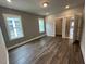 Bedroom featuring gray walls, neutral carpet, and two windows at 508 Yeowell Dr, Chapel Hill, NC 27514