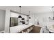 Modern kitchen featuring white cabinets, stainless steel appliances and a large island at 508 Yeowell Dr, Chapel Hill, NC 27514