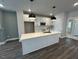 Modern kitchen with white cabinetry, an island and stainless steel appliances at 508 Yeowell Dr, Chapel Hill, NC 27514