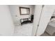 Bright mudroom with bench, pillows, and a modern mirror at 508 Yeowell Dr, Chapel Hill, NC 27514
