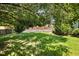 Spacious backyard with lush green grass and a privacy fence, perfect for outdoor activities at 608 Kinship Ln, Apex, NC 27502