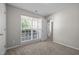 Neutral bedroom with carpet, natural light from window, and white trim at 608 Kinship Ln, Apex, NC 27502