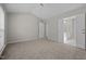 Spacious bedroom with neutral colors, a ceiling fan, and access to the bathroom at 608 Kinship Ln, Apex, NC 27502