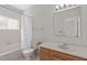 Functional bathroom with a vanity, toilet, and tiled tub/shower combination at 6131 Summerpointe Pl # 101, Raleigh, NC 27606