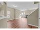 Bright open concept featuring hardwood floors, fireplace and large windows at 6131 Summerpointe Pl # 101, Raleigh, NC 27606