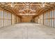 Spacious garage with unfinished walls, concrete floors, and high ceilings at 7849 Circle L Trl, Rougemont, NC 27572