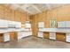 Large barn interior with ample cabinet space, ceiling fan and natural light for projects or storage at 7849 Circle L Trl, Rougemont, NC 27572